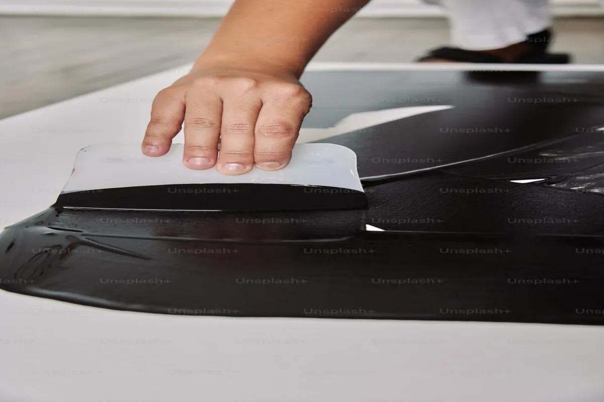 Black car with deep gloss finish after ceramic coating application