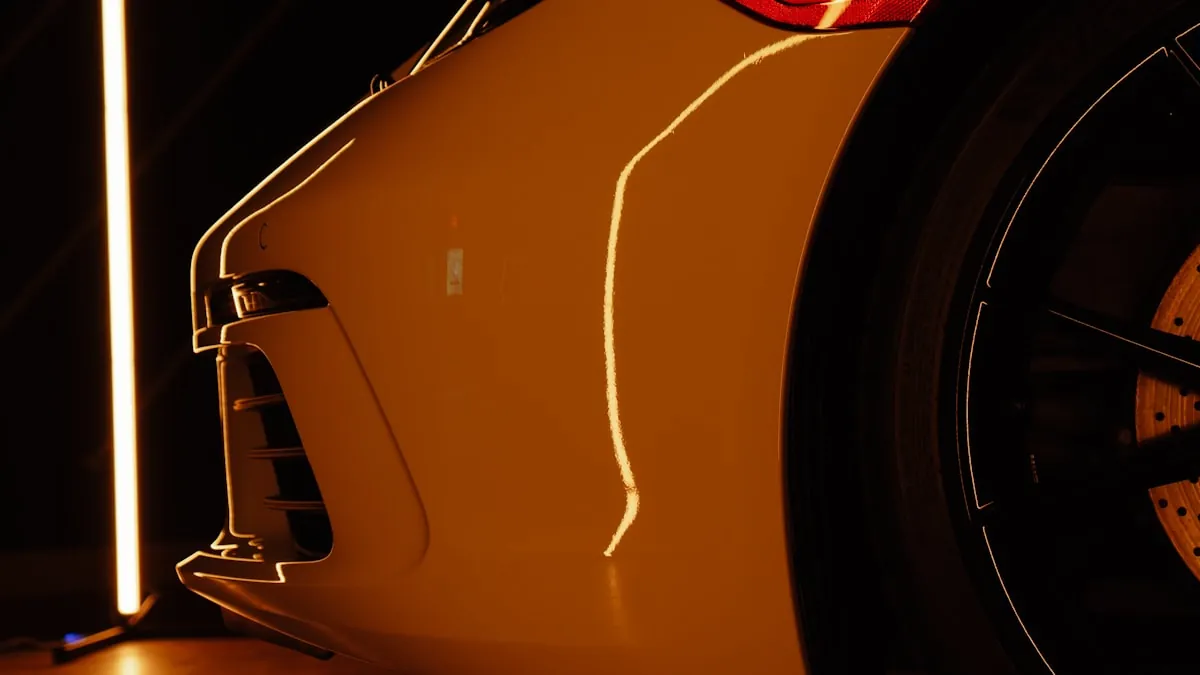 Close-up of exotic sports car paint panel under dramatic lighting at EuroLuxe Detailing in Tomball TX